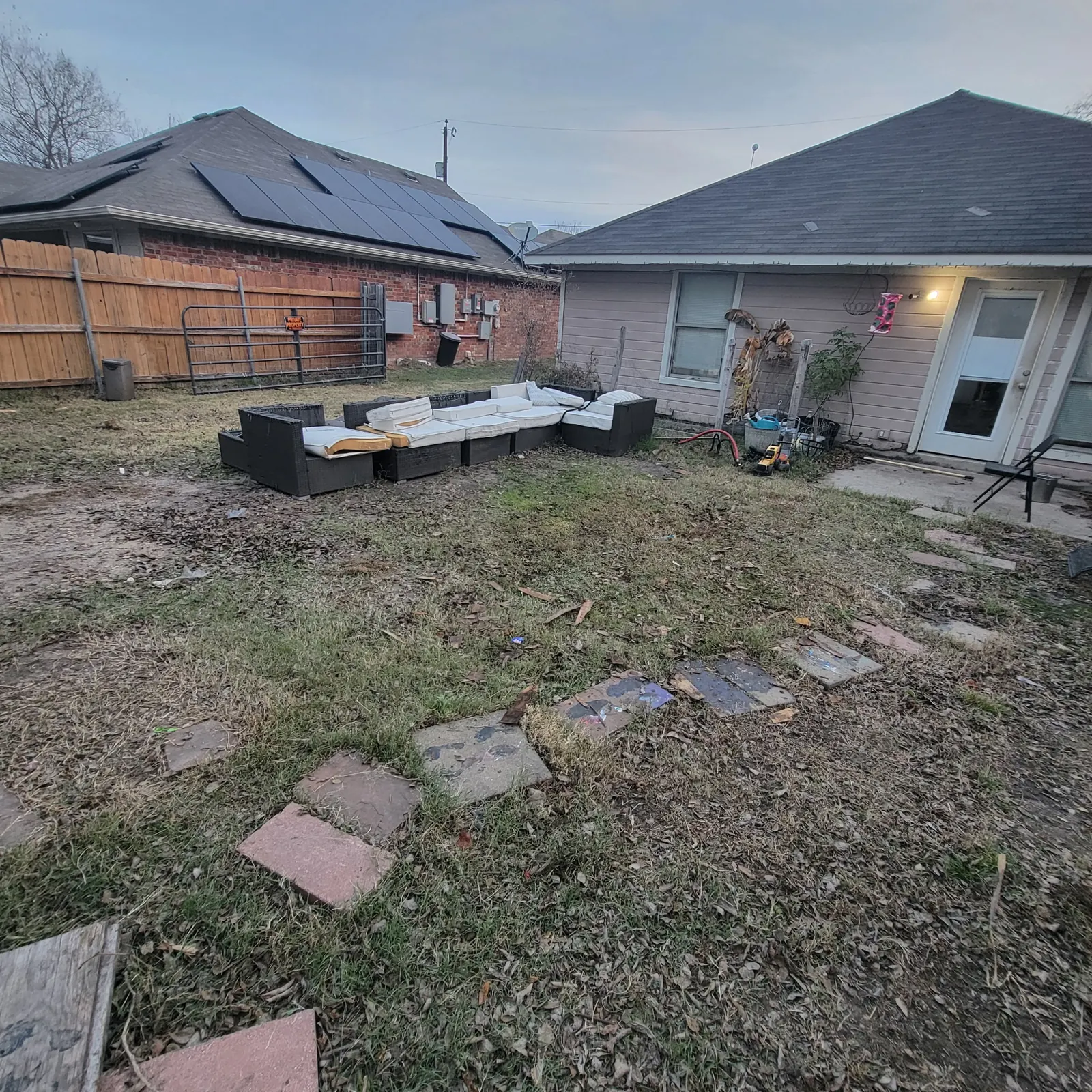 Tidy backyard with patio furniture arranged
