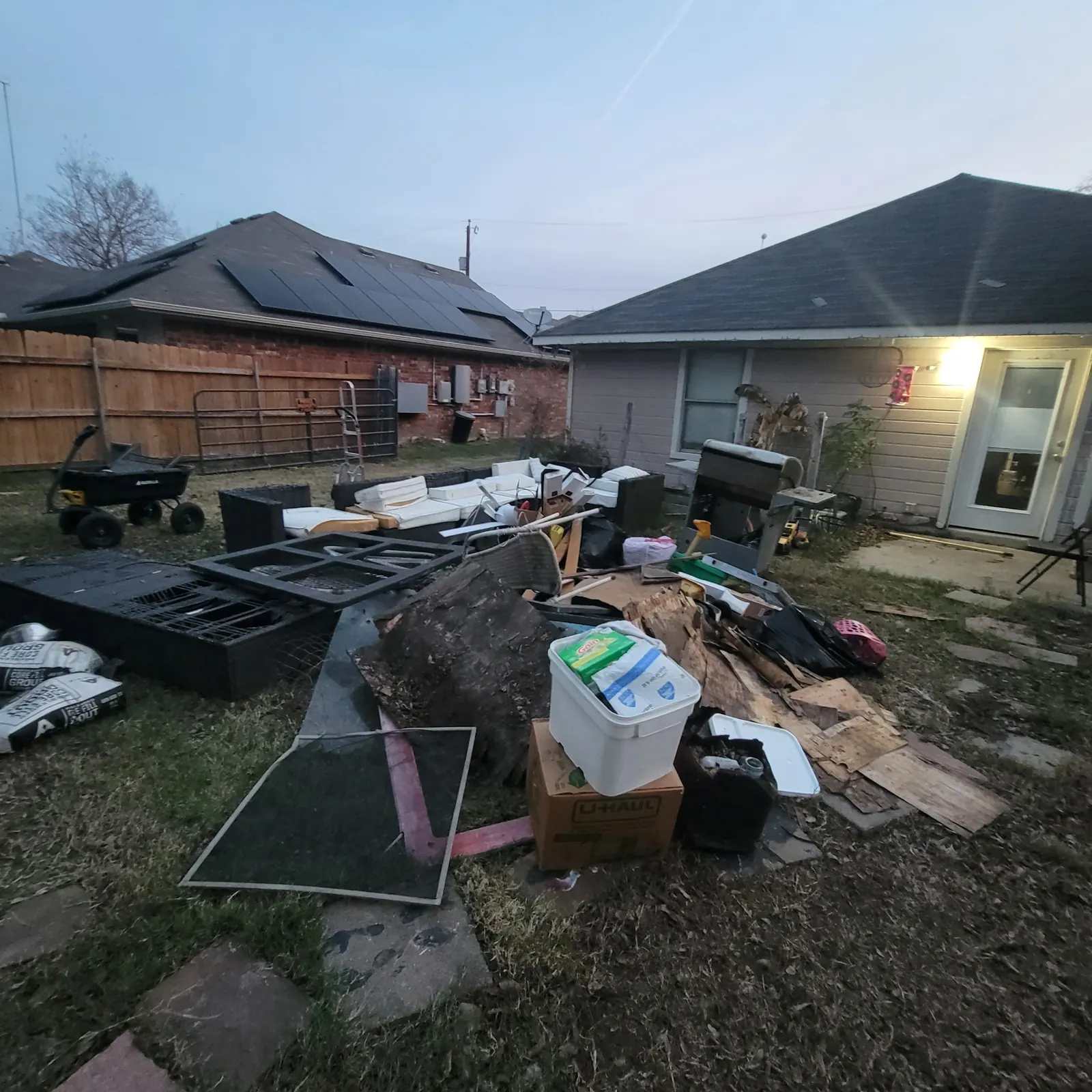 Backyard scattered with junk before removal
