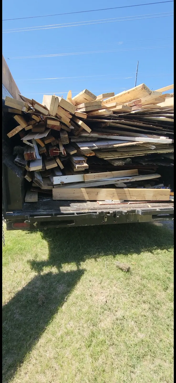 Trailer loaded with lumber and demolition debris