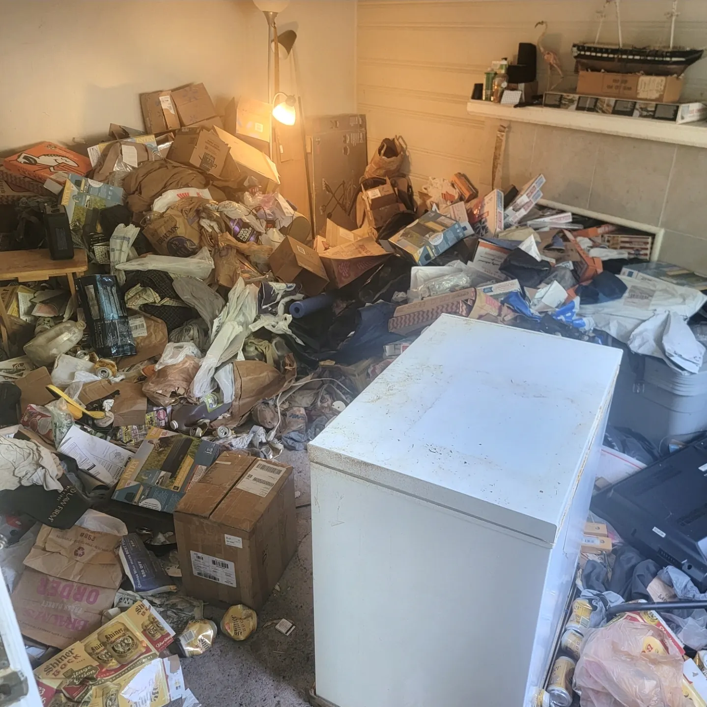 Room piled with items before hoarding cleanout