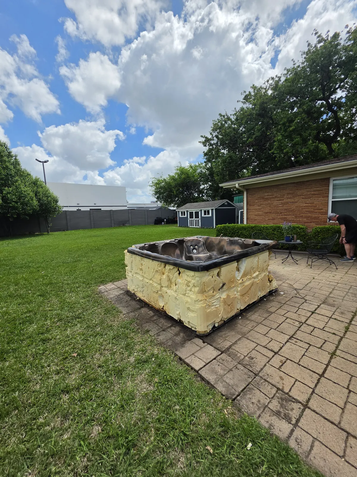 Old hot tub on patio before removal