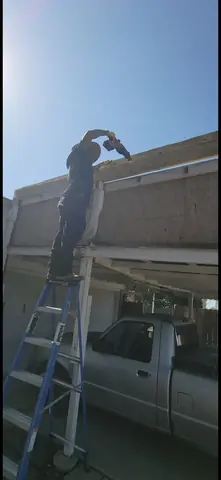 Crew demolishing patio cover
