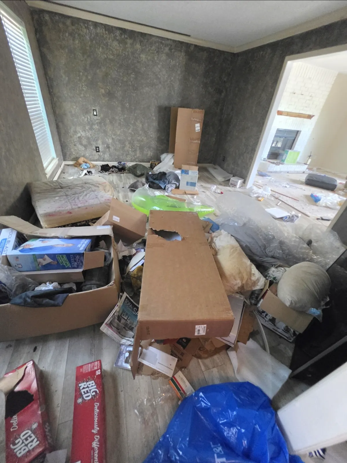 Cluttered room before full cleanout